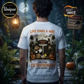 Snoopy x Jurassic Park Life Finds A Way T-Shirt features a graphic of Snoopy as a park ranger with Woodstock at the gate.