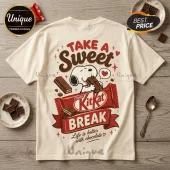 Off-white t-shirt featuring Snoopy eating a KitKat bar with text Take a Sweet Break and Life is better with chocolate.!