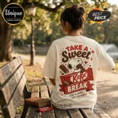 Woman wearing cream t-shirt with Snoopy eating a KitKat graphic, text reads Take A Sweet Break, Life is better with chocolate.!