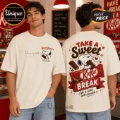 Off-white oversized cotton t-shirt featuring Snoopy holding a KitKat bar on the chest and back with red text graphics.!