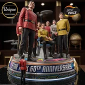 Star Trek 60th Anniversary Acrylic Plaque featuring miniature crew members in red and gold uniforms on a circular base.