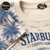 Starbucks Nautical Coffee Special Edition T-Shirt featuring blue palm trees and ocean motifs on a cream cotton fabric.