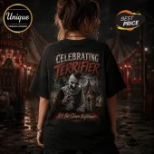 Black oversized t-shirt featuring Art the Clown from Terrifier with red bloody text graphics and a carnival background.!