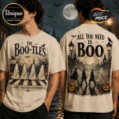 Beige graphic t-shirt featuring The Boo-tles print with ghosts crossing a street and text reading All You Need Is Boo.!