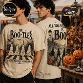 Beige cotton t-shirt featuring The Boo-tles graphic of four ghosts crossing a street and text reading All You Need Is Boo.!