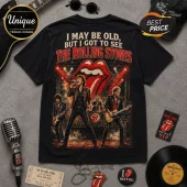 The Rolling Stones Vintage Tour I May Be Old T-Shirt featuring band members, classic tongue logo, and concert stage art.