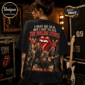 The Rolling Stones Vintage Tour I May Be Old T-Shirt on a person, featuring a concert graphic and red tongue logo.