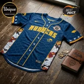 Blue Mudhens baseball jersey with yellow script lettering, scale pattern, and red dragon motifs on side panels.!