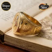 Winnie the Pooh 100th Anniversary gold engraved ring resting on a vintage book with detailed ornate side filigree.