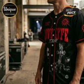 Black short-sleeve baseball jersey with red pinstripes and red Yeat Love-Lyfe tour graphics including a cross and sun logo.!