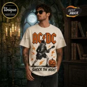 AC/DC High Voltage Halloween Off-White T-Shirt featuring a skeleton guitarist, orange lightning, and a jack-o-lantern graphic.