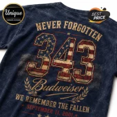 Budweiser 9/11 Remembrance Tribute T-Shirt in navy blue with distressed 343 graphic, American flag pattern, and gold text.