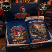 Newcastle Knights Mascot Royal Blue T-Shirt featuring a graphic of the knight mascot on a beach with tropical motifs.