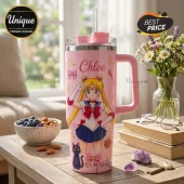 Personalized Sailor Moon Pink Stainless Steel Tumbler featuring anime character artwork, a handle, and a straw on a table.