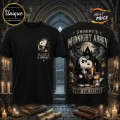 Snoopy Blessed and Spooky Halloween 2026 shirt featuring cartoon beagle in nun habit holding a candle on black cotton fabric.