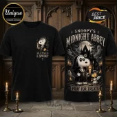 Snoopy Blessed and Spooky Halloween 2026 shirt featuring Snoopy as a nun holding a candle and Woodstock as an angel.