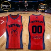 Spider-Man x Toronto Raptors 2026 Edition Basketball Jersey featuring red and blue spiderweb patterns on a basketball court.