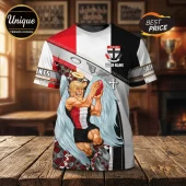 St Kilda Football Club Mascot T-Shirt featuring a cartoon angel character holding a football on a red, black, and white.